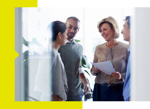 A diverse group of business professionals engaged in discussion.