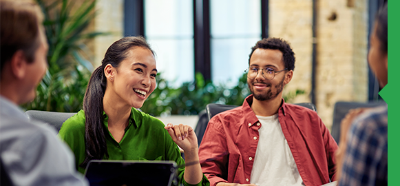 A group of professionals gathered around a table sharing insights. A group of professionals gathered around a table sharing insights.
